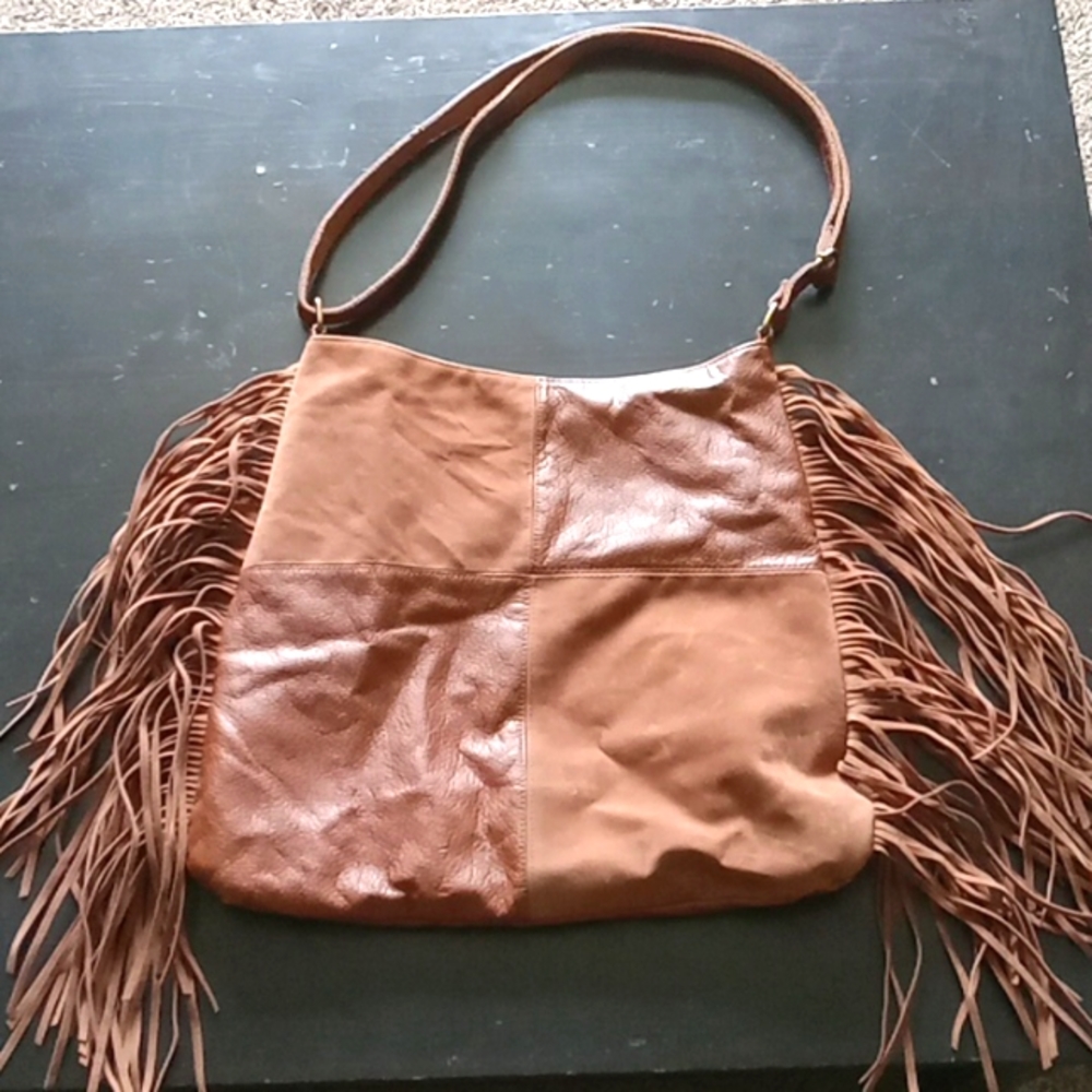T shirt and jeans fringe shoulder bag